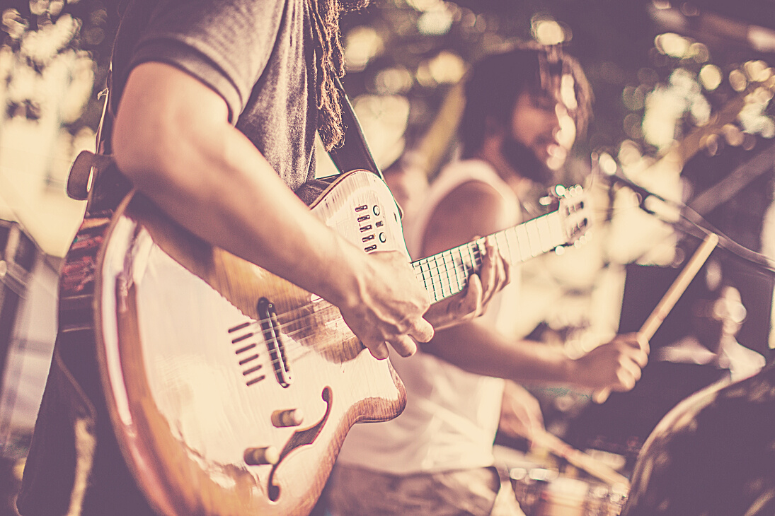 Person Playing The Guitar